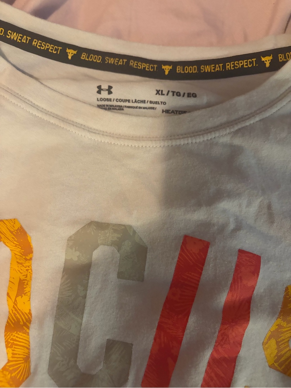 Under Armour Men’s White Short-Sleeve Graphic Tee with Red & Yellow Accents